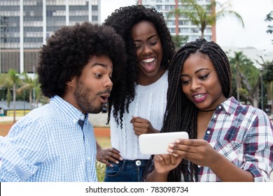 Group Of African American People Looking At Phone