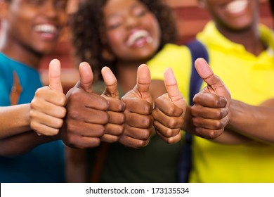 Group Of African Friends Thumbs Up Close Up