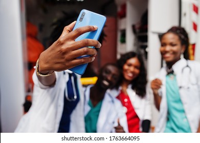 Group Of African Paramedic Ambulance Emergency Crew Doctors Making Selfie On Phone.