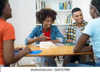 Group of african and south american students in discussion at classroom of university