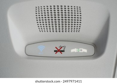 Group of Air control knobs in a new plane, Wi-Fi is included, light for belt warning signals and no smoking on the plane