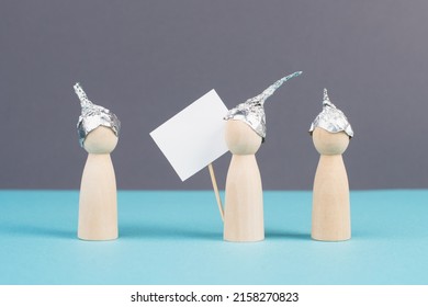 Group With Alu Hats Protesters Talking Together, Conspiracy Theories, Tin Foil On The Head, Holding An Empty Sign, Conversation And Communication Concept 