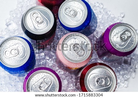 Group of aluminium cans in ice, cold drink. Top view.
