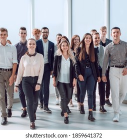 Group Of Ambitious Young People Enter A New Office