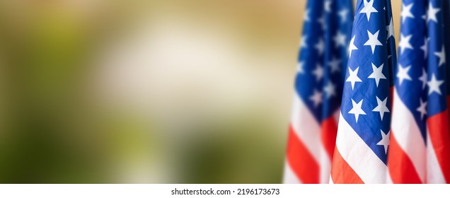 Group of American flags in green background. - Powered by Shutterstock