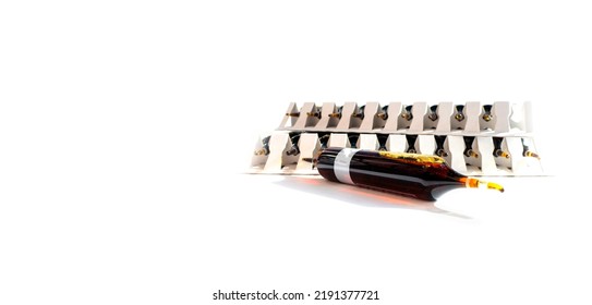 Group Of Ampoules With A Transparent Medicine In Medical Laboratory. Horizontal Perspective View Of Many Brown Ampoules Set In Pharmaceutical Packaging White Container