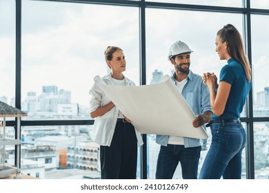 Group of architect engineer looking at project plan while brainstorming idea about building structure. Manager team discuss about building construction while standing near with city view. Tracery. - Powered by Shutterstock