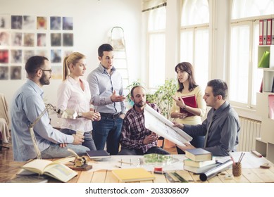 Group Of Architects Having Meeting