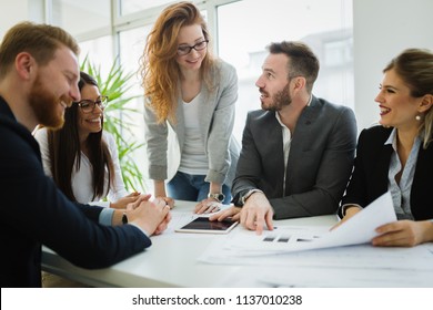 Group of architects working together on project - Shutterstock ID 1137010238
