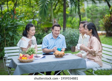 Group Of Asia Family And Friends Happiness Meeting, Lifestyle People Middle Age Outdoor Party. Communication Social Online Life Of Asian People.