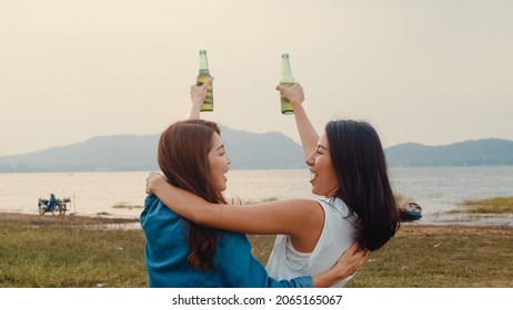 Group Of Asia Girl Couple Best Friends Teenagers Drinking Have Fun Salute Toast Of Bottle Beer Enjoy Party With Happy Moments Together In Campsite. On Background Beautiful Nature, Mountains And Lake.