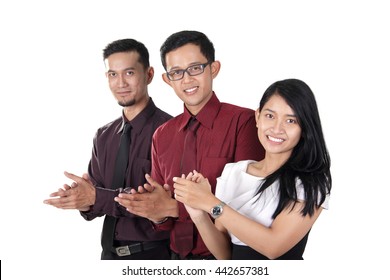 A Group Of Asian Business People Clapping Their Hands Together And Smiling At Camera, Isolated On White Background