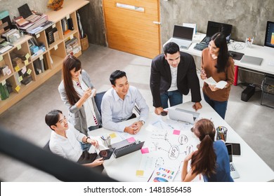 Group Of Asian Business People And Creative Designer Meeting In Office, Top View