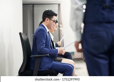 Group Of Asian Business People Men And Women Waiting In Line For Job Interview