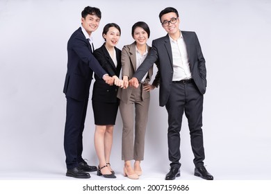 Group Of Asian Business People Posing On A White Background
