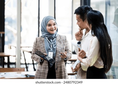 Group of Asian business people talking in meeting office, Business about business startup projects concept. - Powered by Shutterstock