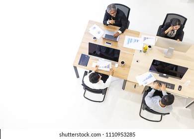 Group Of Asian Business People Working Together In Modern Office,m Taken From Top View High Angle.