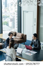 Group Of Asian Businessperson Meeting In The Office. Group Discussion. Management Strategy. Brainstorming.