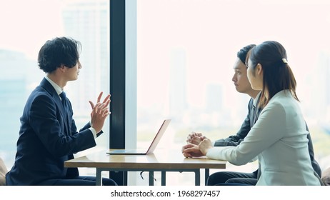 Group Of Asian Businessperson Meeting In The Office. Group Discussion. Management Strategy. Brainstorming.