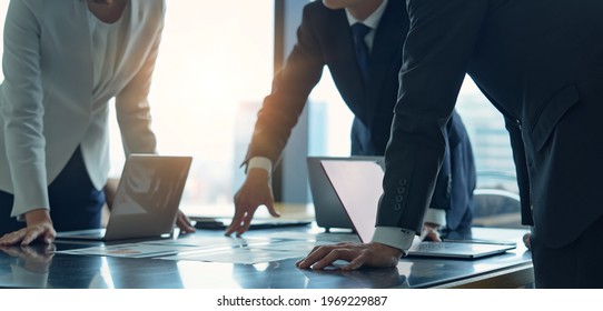 Group of asian businessperson meeting in the office. Group discussion. Management strategy. Brainstorming. - Shutterstock ID 1969229887