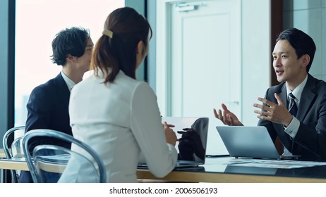 Group Of Asian Businessperson Meeting In The Office. Group Discussion. Management Strategy. Brainstorming.