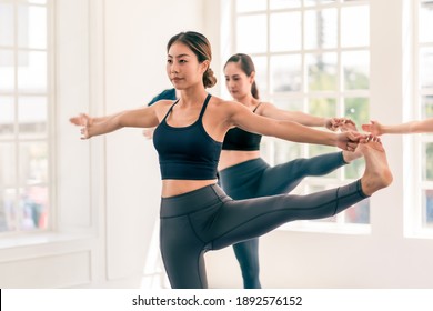 Group Of Asian And Caucasian, Male And Female Yoga Together In Indoor White Studio With Natural Light. Concept Of Diversity, Multi Ethnic Group Of People And Healthy Lifestyle