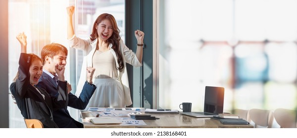 Group of Asian creative business team happy to be successful project, partnership teamwork concept. - Powered by Shutterstock