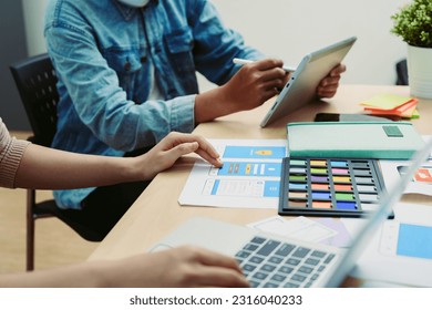 Group of asian creative team programing designers participate in all phases of the UX UI design