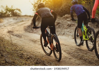 Group of Asian cyclists, they cycle through rural and forest roads. - Shutterstock ID 1938194917