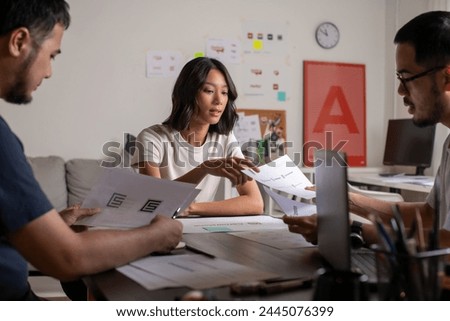 Group of Asian designers woman and man Graphic designer working in office. Artist Creative Designer Illustrator Graphic Skill Concept.