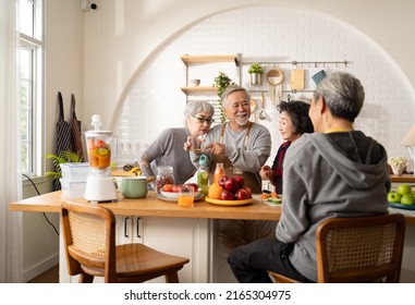 Group Of Asian Elder People Friends Making Vegetables Salad And Fruit Juice With Her Daughter In Kitchen At Home.concept Of Group Asia Senior People Healthy Eating,colorful Fruits And Vegetables.