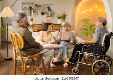 Group Of Asian Elder People Friends Are Sitting On Sofa In The Living Room At Nursing Home.older Asian Friends Retired People Hapiness Positive Laugh Smile Conversation Together In Adult Daycare Cente