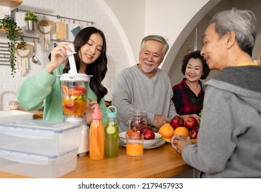 Group of Asian elder people friends making vegetables salad and fruit juice with her daughter in kitchen at home.concept of Group asia senior people Healthy eating,colorful fruits and vegetables. - Powered by Shutterstock