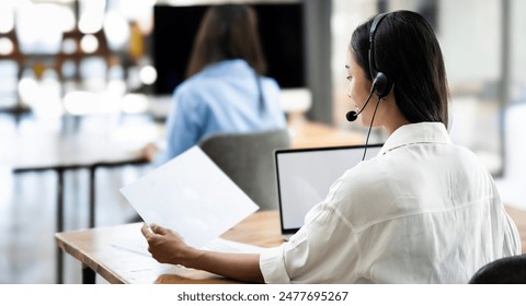 Group of asian female call center with headset service support customer by computer at office. - Powered by Shutterstock