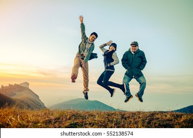 Group Of Asian Friends Having Fun Jumps On Sunset And Mountains With Filter Effect