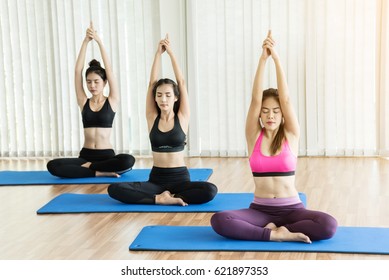 Group Asian Girl Stretching Before Yoga.