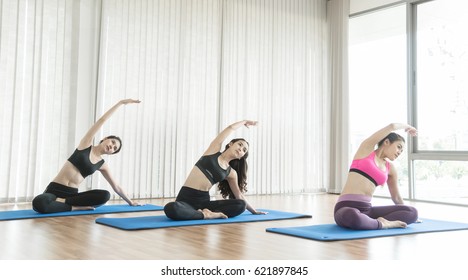 Group Asian Girl Stretching Before Yoga.