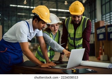 Group of Asian industrial worker has meeting to brainstorm and discuss at warehouse factory workplace. Industrial worker has planning and discussing scene. Auditor working onsite. - Shutterstock ID 2226038513