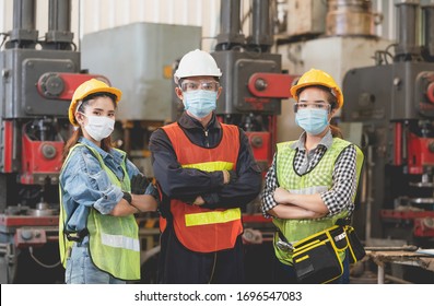 Group Of Asian Male And Female Engineers Wearing Hygienic Mask Protect With Helmet Safety In Factory Industrial.Coronavirus Protective, Safety Concept