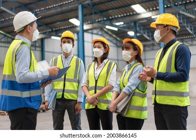 Group of Asian male and female engineers wearing hygienic mask protect with helmet safety in factory Industrial.Coronavirus Protective, safety concept - Powered by Shutterstock