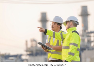 Group Asian man petrochemical engineer working at oil   gas refinery plant industry factory The people worker man engineer work control at power plant energy industry manufacturing