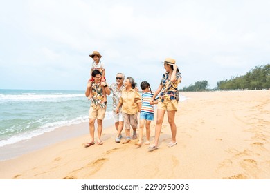 Group of Asian Multi-Generation family in casual clothing enjoy and fun outdoor lifestyle walking and playing together at tropical beach during travel island ocean at sunset on summer holiday vacation - Powered by Shutterstock