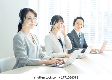 Group of asian operator. Call center. Customer support.