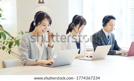 Group of asian operator. Call center. Customer support.