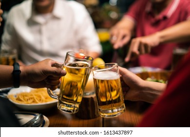 Group Of Asian People Have A Dinner Party And Beer At Home.