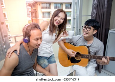 Group Of Asian People Have A Mini Party Together In Room, Party Concept.