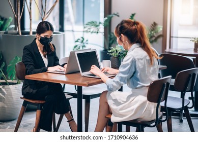 Group Of Asian People Successful Teamwork Businesswoman Wearing Medical Mask And Working With Laptop. Work From Private Home Office Social Distancing Among Coronavirus Outbreak Situation