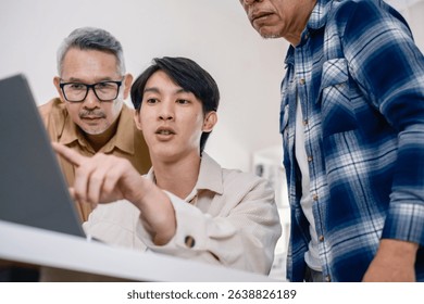 Group of asian senior in a collaborative software development analyzing  flowcharts  during a bootcamp training