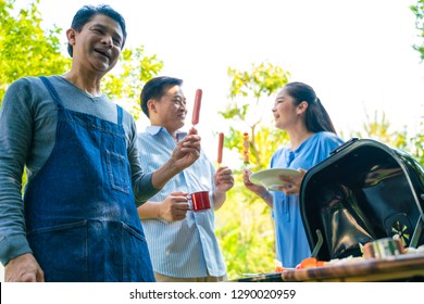 Group Of Asian Senior Early Retirement Party In Green Park Outdoor BBQ Food And Drink