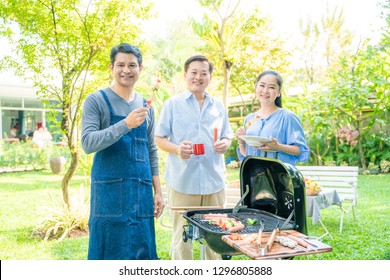 Group Of Asian Senior Early Retirement Party In Green Park Outdoor BBQ Food And Drink